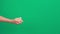 Hands stretching out and giving small gift box over green screen chroma key background