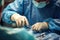 Hands of a surgeon in an operating room close-up, steady and precise gloved hands delicately manipulate surgical instruments