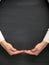 Hands surrounding a blackboard background