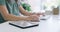 Hands, tablet and business woman on computer, mouse and keyboard at office desk in startup. Closeup, digital technology