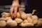 Hands taking out home made small wheat corn breads out of stove