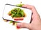 Hands taking photo fish with salad with smartphone