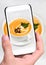 Hands taking photo pumpkin soup with smartphone