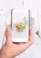 Hands taking photo radish salad with smartphone