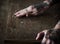 Hands with tattoo using sandpaper on a wood