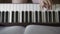 Hands teenager girl playing on the keyboard of the digital piano