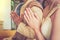 Hands of Thai groom and bride pray to the monk