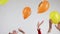 Hands throw up balloons with cryptocurrency logo.
