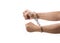 hands with tight fists on handcuff reaching out on white background