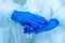 hands together of scientists wearing protective suit and face mask diagnosis vaccine virus in science clinical