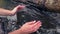 Hands in Transparent Clear Water From Natural Well