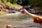 Hands traveler solo woman holding compass at waterfall,Navigation for travel
