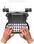 Hands type on antique typewriter copyspace