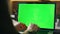 Hands typing greenscreen laptop at office closeup. Freelancer working chroma key