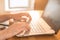 Hands typing on a notebook closeup. Workplace