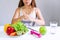 Hands of unhappy Asian woman in singlet doing a sign say no to vegetables and fruits with bored emotion on dieting time. Healthy