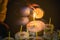 Hands of unidentified people with burning candles at funeral ceremony. Religion and mourning concept