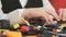 Hands of unknown child playing with building kit