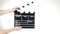 Hands use movie production clapper board, on white