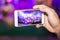 Hands use smartphones record small music concert live streaming video on internet to social media