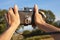 Hands on vintage camera in the countryside. Travel background.