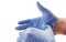 Hands wearing blue medical latex gloves Protection against flu, virus and coronavirus. Health care and surgical concept. Correct