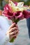 Hands with wedding bouquet