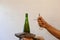 Hands on wine bottle