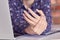 Hands of woman with carpal tunnel syndrome over computer keyboard close-up.