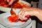 Hands of woman dishing Italian food