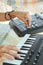 Hands woman DJ playing electronic music with a mixing table