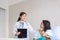 Hands woman doctor reassuring her female asian patient in hospital room,Doctor giving a consultation and encouragement to patient