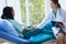 Hands woman doctor reassuring her female patient in hospital room,Doctor giving a consultation and encouragement to patient