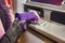 Hands of woman with gloves pulls in debit card