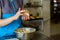 Hands of woman holding cookie.