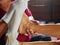 Hands of a woman holding an older person`s feet, while gently wiping / cleaning it with a wet washcloth - giving an elderly a bed