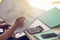 Hands of woman holding paper bill letter doing paperwork bill reading good news sit at home table