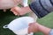 Hands of a woman milking fresh milk from a dairy cow simulate