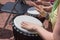 Hands of a woman playing a drum closeup