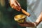 Hands of a Woman Playing Tibetan Singing Bowl in Nature