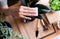 Hands woman using cotton wipe dust off leaves,Clean the leaves of houseplants,Plant Grooming