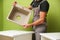 Hands of worker installs kitchen sink