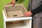 Hands of worker installs kitchen sink