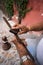 Hands of a worker sharpening a rusty machete in mexico