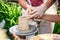 Hands working on pottery wheel. Sculptor, Potter. Human Hands creating a new ceramic pot.