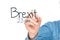 Hands writing brexit