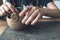 Hands of a young artist, modeling a clay bowl in art studio.  Traditional pottery craft. Ceramics workshop concept