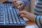 Hands of young child using keyboard to playing 3