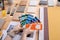 Hands of young female creative designer holding color palette over table