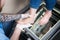 The hands of a young man doctor orthopedist conducts diagnostics, foot foot test of a woman, for the manufacture of individual, or